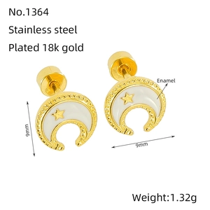 Detail view of 9mm gold plated stainless steel moon and star earrings with enamel