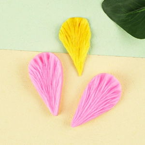Silicone flower petal fondant molds creating realistic peony and leaf textures for cakes