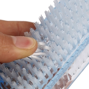 Soft double-sided medical scrub brush with blue plastic handle for nail and hand cleaning