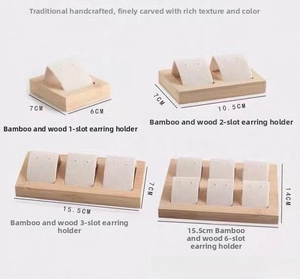 Bamboo jewelry organizer showing different sizes of earring display stands with slots