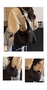 Close-up of black nylon tote bag featuring a vintage brown leather logo patch and stitching