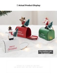 Close-up of colorful metal Christmas mailboxes with Santa, snowman and functional lid