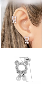 Detail showing stainless steel bear earring with zircon inlay and pearl drop charms