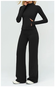 Detailed view of black workout set with thumbhole sleeves and high-waist wide-leg pants