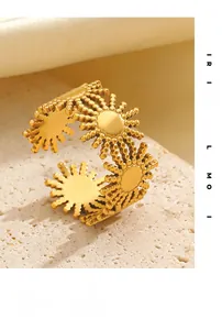 Macro view of 18K gold plated sunburst ring with retro beaded texture on stone