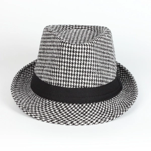 Detailed view of black and white houndstooth pattern and ribbon on this classic jazz hat