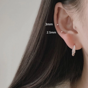Close-up of 925 sterling silver ball studs and hoop earring showing 2.5mm and 3mm sizes