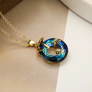 Golden bee necklace with round blue crystal pendant, elegant geometric jewelry for women