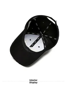 Interior view of black baseball cap with logo-taped seams and adjustable metal buckle