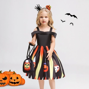 Detail of girl's Halloween pumpkin dress with matching headband and candy bag accessories