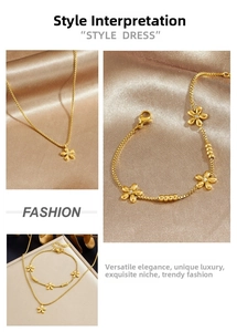 Detailed view of golden flower jewelry set with sparkling rhinestones on champagne satin