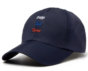 Detail of navy quick-dry baseball cap with letter embroidery and laser-cut vents