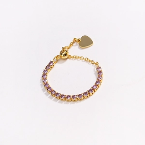 Detail of adjustable gold ring with purple zircon tennis chain and heart charm