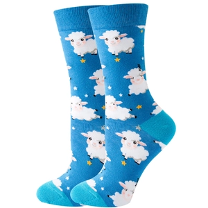 Detail view of blue mid-calf socks featuring white cartoon sheep and turquoise accents