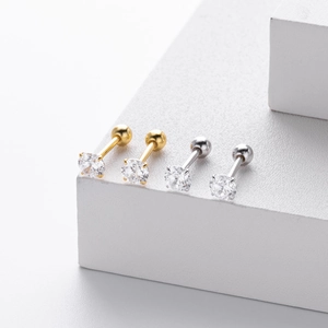 Detailed view of gold and silver S925 sterling silver screw back stud earrings with zircon