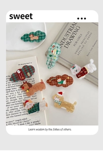 Detail showing acrylic cartoon cat and dog hair clips with winter Christmas theme motifs