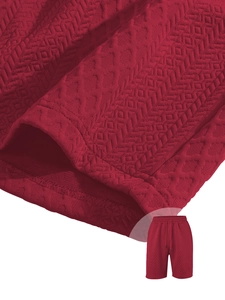 Detailed macro of red jacquard texture and drawstring waist on men's casual shorts