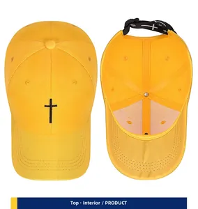 Detailed view of yellow baseball cap featuring cross embroidery and interior lining