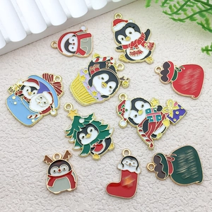 Detail view of assorted Christmas penguin and tree alloy pendants for DIY jewelry making