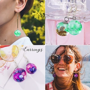 Detailed views of handmade resin sphere earrings featuring vintage gears and colorful stones