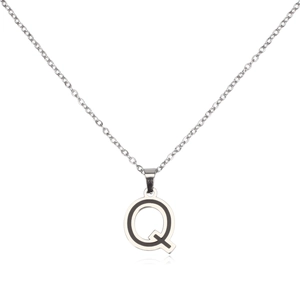 Detailed macro shot of silver stainless steel letter Q pendant on a fine link chain