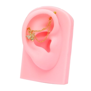 Macro view of gold bee stud earring with double chain and sparkling white zircon detail