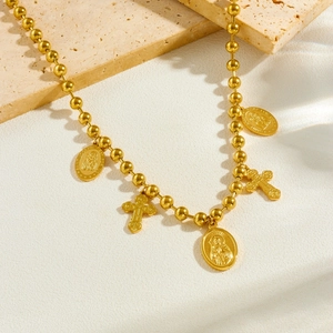 Vintage gold plated beaded chain necklace with St. Joseph oval medallion and cross pendant