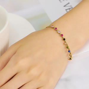 Golden Evil Eye bracelet for women with colorful zircon stones in Bohemian style on wrist