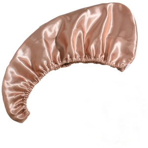 Close-up of champagne silk satin hair bonnet showing smooth texture and elastic detail