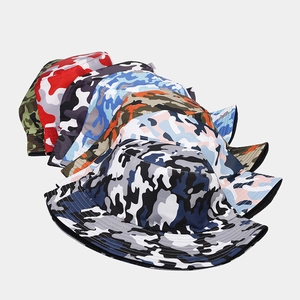 Detailed close-up showing stacked camouflage bucket hats in various stylish colors