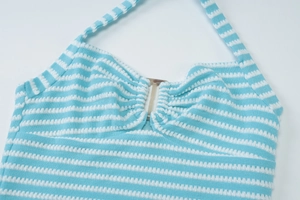 Detail of blue and white striped knit halter top with central metal ring buckle