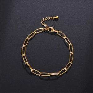 Close-up of golden stainless steel chain bracelet with lobster clasp and extender