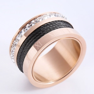 Rose gold stainless steel wide band ring with cubic zirconia, cable wire, and Roman numerals