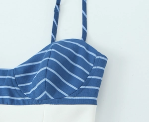 Close-up of blue and white striped camisole top with textured fabric and cup seams
