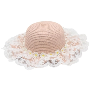 Detail of pink straw sun hat featuring white lace trim and daisy flower decorations