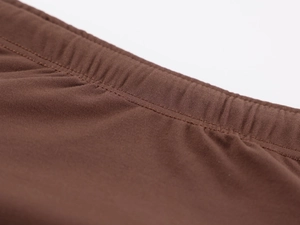 Detailed view of the fine stitching and soft ribbed fabric texture on a brown tube top