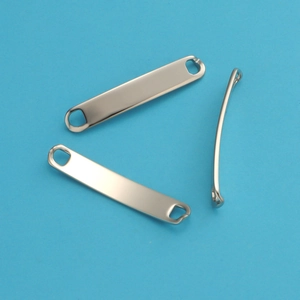 Detailed view of three polished silver stainless steel curved connector charms for DIY jewelry