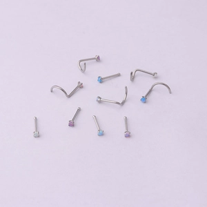 Titanium steel nose studs with 2mm mini opals in white, pink, and blue colors
