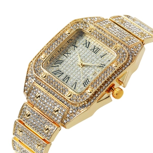 Luxury gold square watch featuring a full diamond-encrusted bezel and Roman dial