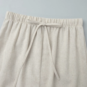 Detail of elastic waist and drawstring on beige cotton linen midi skirt set