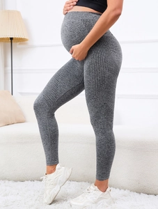 Close-up of maternity high-waisted shark leggings with breathable mesh side texture
