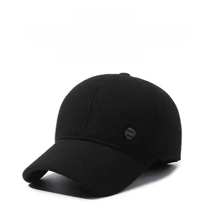 Close-up of black winter baseball cap with thick knit texture and metal SPORT emblem