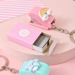 Pink mini stapler set with cute rainbow cloud design and portable keychain attachment