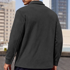 Men's dark grey fleece tactical shirt jacket in outdoor city setting, back view shot
