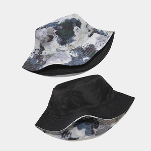 Chapeau bob réversible avec imprimé graffiti marbre et face noire pour protection solaire