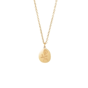 Golden heart necklace with intricate rose engraving in a gothic minimalist style