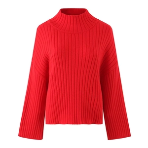 Detailed close-up showing the vertical ribbed knit texture of this red high-neck sweater
