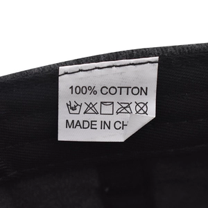 Detailed close-up of 100% cotton wash label on a vintage washed baseball cap