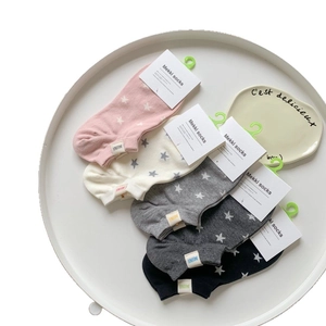 Five pairs of cotton star pattern ankle socks in pink, white, grey, and black