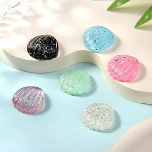 Glittery resin seashell charms in various colors for DIY accessories and phone cases